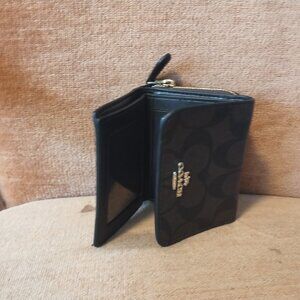 Black and brown leather Coach wallet